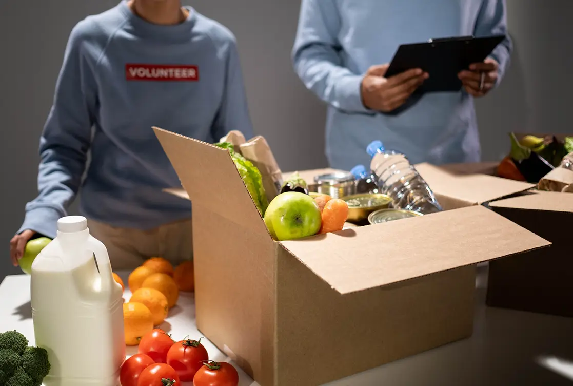 Fruit in a box by volunteer worker